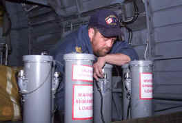 Bucky working on the sonobuoy chutes in the back of the helo.