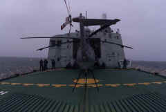 Helo half way into hangar for blade change