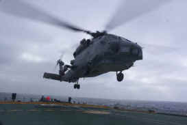 An American Military Sea Hawk landing on our deck.