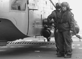 'Bucky' Dent and Steve Dawson await instructions from the Chief to remove the torp