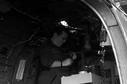 Pat working in the aft cabin of the helo.