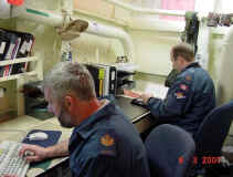 The Sarge playing video games, and the Chief, reading Harlequins... tsk tsk tsk!