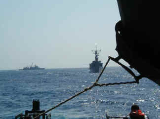 Fleet with helo blade in foreground