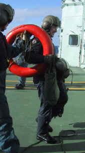 Shivering and cold, Mark is welcomed back onboard