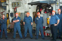 The Hangar Posse waits for the admiral to show up