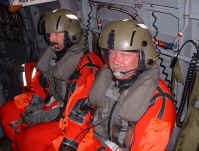 Rob 1 and Rob 2 in the helo in their immersion suits